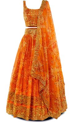 Orange you gonna be cute in this? Yes, you sure will! This 3-piece orange lehenga is your ticket to citrus chic. The lehenga is adorned with stunning gold embroidery and sequins all throughout. Get ready to peel off ordinary and stand out at your next Indian event! This outfit is perfect for any Indian festivity, especially the Haldi ceremony. Orange Georgette Sharara For Navratri, Orange Georgette Sets For Festivals, Orange Georgette Sharara With Traditional Drape, Designer Orange Sharara With Zari Work, Festive Designer Orange Sharara, Festive Orange Designer Sharara, Designer Orange Sharara With Sheer Dupatta, Festive Orange Sharara With Sheer Dupatta, Orange Georgette Sharara For Festivals