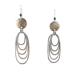 Gold & Silver Earrings - These silver and 14k gold-filled hoops are shaped by hand, then hammered and oxidized to emphasize their distressed look. Lightweight and comfortable, their silver and gold mix takes them easily from day into night. Sterling silver ear wires. Gold Filled Hoops, Artful Home, Disc Earrings, Oval Earring, Metal Earrings, Silver And Gold, Ear Wires, Precious Metals, Gold Filled