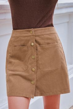 Add a touch of vintage charm with this Brown Front Button Pocket Mini Skirt. The playful pockets and warm color make it a versatile addition to your wardrobe, perfect for any casual outing. Product code: CAA02A4J001HH Features:  Woven Front buttons Pockets Mini Wash Method: Regular Wash Material: 100%POLYESTER. Trendy Winter Skirt With Pockets, Fall High Waist Mini Skirt With Pockets, High Waist Mini Skirt With Pockets For Fall, Brown Cotton Mini Skirt With Pockets, Beige High Waist Mini Skirt With Pockets, Beige High-waist Mini Skirt With Pockets, Brown Mini Skirt With Button Closure For Work, Chic Brown Skirt With Pockets, Brown Solid Color Mini Skirt