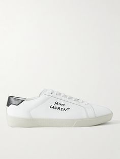 SAINT LAURENT's 'SL/06' sneakers pay homage to classic tennis styles. Made with leather uppers and rubber soles, they're treated to soften the hide. The brand's moniker is embroidered at the sides and subtly debossed at the heel tabs. Luxury White Suede Sneakers, Leather Low-top Sneakers With Embroidered Logo, Saint Laurent White Sneakers, Luxury Leather Slip-on Sneakers With Stitched Sole, Luxury Men's White-soled Slip-on Sneakers, Leather Sneakers Men, Embroidered Leather, Saint Laurent Shoes, Classic Logo