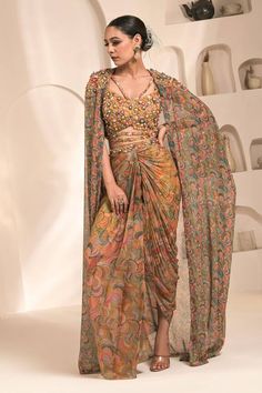 Yellow and multi colored printed cape with hand embellishments. Comes with coordinating draped dhoti skirt and hand embellished bustier. - Aza Fashions Dhoti Skirt, Draped Fabric, Skirt Pattern, Set For Women, Aza Fashion, Multi Colored, Graduation Dress, Skirt Set, Cape