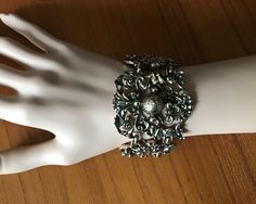 "This is: An original vintage 50s Jewelcraft bracelet. Stunning art nouveau style, with decorative heavy metal links - each signed. Hard to come by, a real rarity. Great condition. Height 5cm 7.5\" length Please see pics for size/weight/condition. Any questions, please message me, thanks. I accept all returns - if you are not happy with your item, please message me before leaving feedback and I will be happy to deal with your concerns. I try my best to be as accurate as possible in my listings, but occasionally I will make a genuine mistake and will rectify it very quickly, just let me know, thanks." Victorian Metal Bangle Bracelet, Victorian Style Metal Bangle Bracelet, Formal Metal Bracelets With Antique Finish, Vintage Metal Cuff Bracelet With Filigree, Victorian Style Silver Party Bracelets, Ornate Metal Bracelets With Antique Finish, Vintage Metal Cuff Bracelet With Intricate Design, Antique Finish Silver Metal Bracelets, Silver Metal Bracelet With Antique Finish