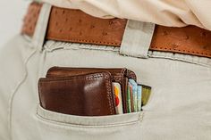 there is a wallet in the pocket of a man's pants