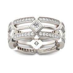 a stack of silver rings with diamonds on each band and two rows of white stones in the middle