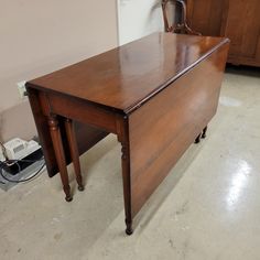 a wooden desk sitting on top of a hard wood floor