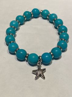 Turquoise bead bracelet, starfish charm, 7.5 inch stretch bracelet, charm bracelet, Artisan made jewelry, Handcrafted bracelet, Mother's Day. If you have any questions, please don't hesitate to contact me. Thanks for looking and have a blessed day! Turquoise Bead Bracelet, Handcrafted Bracelets, Made Jewelry, Bracelet Charm, Beaded Jewelry Diy, Jewelry Diy, Turquoise Beads, Bead Bracelet, Stretch Bracelet