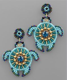 a pair of beaded sea turtle earrings