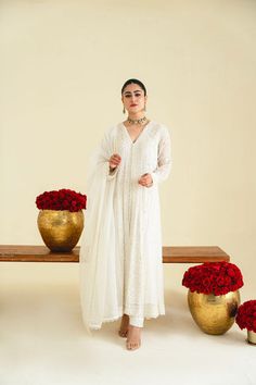 An alluring open kalidaar in pure ivory cotton net with intricate floral embroideries are laid out alongside pearls sequins and moti detailing. Paired with a beautifully embroidered dupatta and matching straight trousers, this gorgeous design is the epitome of effortless elegance. Order Duration: 4 to 6 weeks Embroidered Dupatta, Straight Trousers, Effortless Elegance, Gorgeous Design, Floral Embroidery, Trousers, Pure Products, Floral, Beauty