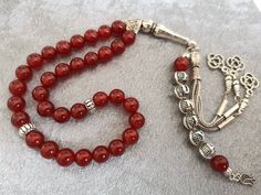 ✔️ This customized rosary made of 8 mm Carnelian Agate beads. ✔️ This top quality memorial rosary is a very special gift for your loved ones. ✔️ Each order comes in a special free gift box. ✔️ PLEASE CLICK THE LINK FOR ALL PRAYER BEADS MODELS https://www.etsy.com/shop/GoodJewelsofYazmasal Note: As a natural feature the stones beads may have some variations. SHIPPING: United States (Standart/DHL eCommerce/usps): 7-10 business days United States (Express/FedEx): 3-5 business days Canada (Express/F