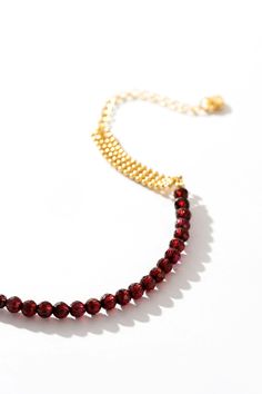 Command attention with our Ruby Woven Gold Bracelet – a statement piece that exudes luxury and sophistication. Picture yourself adorned in radiant rubies and gleaming gold, each bead a testament to your refined taste and style. With every movement, you'll captivate onlookers, leaving them breathless in awe of your undeniable presence. Elevate your ensemble and let this bracelet be the crowning jewel of your look, a symbol of your unapologetic confidence and allure. Elegant Ruby Round Beads Jewelry, Elegant Ruby Gemstone Beads Bracelets, Elegant Red Chain Bracelet With Jubilee Design, Elegant Polished Beads Bracelet For Party, Elegant Red Jubilee Chain Bracelet, Gold Crystal Bracelet With Beaded Chain, Gold Crystal Bracelet With Round Beads And Beaded Chain, Elegant Gold Bracelets With Ruby, Elegant Gold Ruby Bracelets