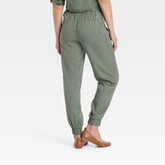 These High-Rise Jogger Pants from Universal Thread™ are made from lightweight lyocell fabric and tailored with a relaxed leg style to keep you in absolute comfort. The full elastic waist with drawstring offers an adjustable, secure fit, while the side pockets provide space for stashing everyday essentials. In a solid hue, they are easy to coordinate with a variety of tops for versatile wear. Universal Thread™: Found exclusively at Target. Lyocell Fabric, Bottom Clothes, Universal Thread, Pull On Pants, Everyday Essentials, Chinos Pants, A New Day, Body Measurements, Jogger Pants