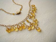 Sale, $40 off.  Handmade, luxury, wire wrapped, golden Citrine gemstone necklace in gold.  Warm, yellow citrines (natural , untreated, faceted, almost transparent gemstones) carefully hand were wire wrapped to 14 k gold filled wire and suspended on 14 k gold fill chain. You will get the same as on the photo necklace.The necklace is 16 inches long, it can be adjusted per request. I can add an extender for you. Genuine, untreated, raw Citrine briolettes are 9 x 6  mm each.   All metal parts are 14 Luxury Yellow Gold Beaded Necklace For Gifting, Luxury Yellow Gold Beaded Gemstone Necklaces, Gold Necklaces With Gemstone Beads For Anniversary, Elegant Gold Jewelry With Yellow Sapphire, Elegant Gold Yellow Sapphire Jewelry, Gold Jewelry With Citrine Gemstone Beads, Luxury Yellow Beaded Necklace For Gift, Gold Wire Wrapped Drop Necklaces, Gold Wire Wrapped Drop Necklace