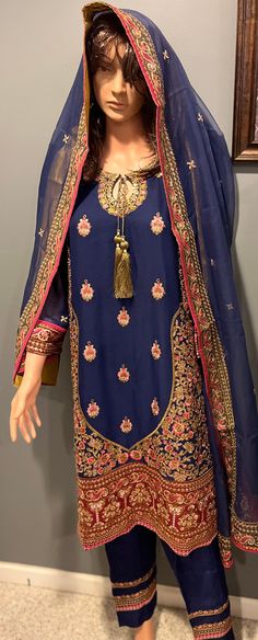 Mesmerizing blue suit full embroidered in pink and golden. Semi-stitched Gold Dress With Floral Embroidery, Elegant Gold Dress With Resham Embroidery, Elegant Semi-stitched Gold Embroidered Fabric, Gold Embroidered Silk Lawn Suit, Eid Salwar Kameez With Gold Embroidery In Georgette, Elegant Gold Embroidered Lawn Suit, Traditional Festive Georgette Suits, Formal Gold Lawn Suit With Resham Embroidery, Gold Lawn Suit With Resham Embroidery For Formal Occasions