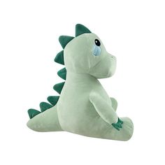 a green stuffed dragon sitting on its back with it's legs spread out and eyes wide open