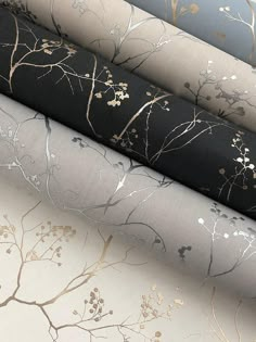 four different types of wallpaper with gold and silver leaves