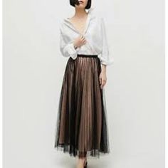 A-Line Skirt Falls Below Knee Length 33.5 Elegant Beige Pleated Skirt For Party, Elegant Beige Pleated Party Skirt, Chic Beige Pleated Tiered Skirt, Chic Beige Pleated Skirt For Party, Beige Maxi Skirt For Spring Evening, Spring Evening Beige Maxi Skirt, Feminine Evening Pleated Skirt, Beige Lined Skirt For Party, Feminine Black Party Skirt