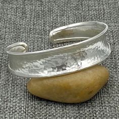 "❋ Handmade Sterling Silver Cuff Bracelet, Hammered Shiny Silver, a little Concave and Framed edges ❋ Width: 9/16 inches (1.5cm) ❋ Size: Medium -large for women/ Small- Medium for man, the Length of the cuff is 6 11/16 inches (6.7\"/ 17cm) ❋ Metal Purity: 95% Pure Silver (Purer than sterling Silver - 92.5%) 5/16 inches Wide: https://www.etsy.com/listing/873886505/ Wider versions: https://www.etsy.com/listing/250878986 https://www.etsy.com/listing/173665269 Matching style Cuff Rings: https://www. Adjustable Hammered Cuff Bangle, Adjustable Hand Forged Cuff Bracelet, Classic Handmade Adjustable Cuff Bracelet, Adjustable Open Band Bangle As A Gift, Classic Hammered Bracelets As Gift, Classic Hammered Bracelets For Gifts, Adjustable Hammered Cuff Bracelet, Classic Hammered Bracelets For Gift, Handmade Adjustable Sterling Silver Bracelet In Classic Style