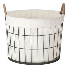 a white and black wire basket with rope handles