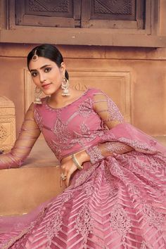 color-pink, fabric-net, work-embroidered, brand-name-krupali-savani,occasion-festivewear, occasion-wedding-guest, womenswear,ideal-for-women, lehengas, Product Features: Color: Pink Lehenga Fabric: Net Choli Fabric: Net Work: Embroidered Sleeves: Full Sleeves Neck Type: Round Neck Wash Care: Dry Clean Occasion: Festivewear, Wedding Guest Product Type: Lehenga Choli with Dupatta Disclaimer: There will be slight difference in digital to actual image Fitted Net Gown For Eid, Fitted Anarkali Net Choli, Fitted Net Gown With Resham Embroidery, Net Embroidered Lehenga For Reception, Festive Fitted Lehenga In Net Material, Designer Net Choli For Eid, Festive Fitted Lehenga In Net, Designer Semi-stitched Net Lehenga, Eid Lehenga With Intricate Embroidery On Net