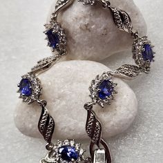 Aaa Tanzanite. White Zircon. Bracelet. (8) In.Platinum Over Sterling Silver. Aaa Tanzanite Ovals (6) Ct.(64) Mm. Prong Set. White Zircon. Rounds. (5.75) Ctw. (5.75) Ctw. Fold Over Clasp. Aaa Tanzanite Color's. Purplish Blues Violet Blues Blueberry. Vivid Vivacious Vibrant Impressive. Gorgeous. No Stacking Required. So Elegant. New. Shipping Box Included. Tiffany Bead Bracelet, Double Chain Bracelet, Zircon Bracelet, Wrap Bangles, Retro Bracelet, Double Wrap Bracelet, Jewelry Logo, Wide Cuff Bracelets, Tory Burch Jewelry