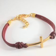 Leather Cross bracelet with adjustable extender chain and lobster claw closure. You may choose from 18 leather color options from the option menu as well as the adjustable size that fits best. Our current production time is 1-3 business days. All our jewelry and gifts are packaged in complimentary gift boxes and a personal note will be included upon request. Please feel free to message us with any question you may have. Thanks for stopping by & God Bless! Adjustable Metal Bracelet With Leather Strap, Adjustable Metal Bracelets With Leather Strap, Adjustable Gold Bracelets With Leather Strap, Adjustable Metal Bracelets For Everyday, Adjustable Gold Leather Bracelets, Adjustable Brown Bracelet With Lobster Clasp, Adjustable Brown Bracelets With Lobster Clasp, Adjustable Gold Leather Bracelet Gift, Adjustable Leather Jewelry With Bracelet Strap