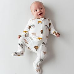 Cut from our silky smooth bamboo rayon, these soft and snuggly footies come in a rainbow of modern, earthy colors. The stretchy material gives you the option of a snug or looser fit, while keeping baby comfortable and stylish. 97% Bamboo Rayon, 3% Spandex Dual zipper Breathable material Sole grips for 6-12 months and up Fold over cuffs to prevent scratching on sizes preemie, newborn, and 0-3 months Please note: Due to how the fabric for prints is cut and sewn each garment will have a unique placement of print. Cow Colour, Book Dress, Jersey Cow, Long Hair Color, Bamboo Clothing, Baby Pajamas, Earthy Colors, Kids Pajamas, A Rainbow