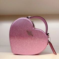 Beautiful Metallic Pale Pinkish Purple Heart Shaped Bag. Coach Leather Statement Purse. Love And Valentine's Day. Treat Yourself Leather Heart-shaped Bag With Detachable Strap, Valentine's Day Evening Bag With Detachable Strap, Elegant Heart-shaped Shoulder Bag For Shopping, Pink Top Handle Bag For Valentine's Day, Luxury Purple Bags For Gifts, Luxury Purple Bag For Gift, Valentine's Day Evening Bag With Top Handle, Valentine's Day Evening Bags With Top Handle, Heart-shaped Pink Bag With Removable Pouch