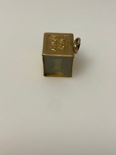 Vintage 14k yellow gold mad money, dollar charm. The charm weighs 4.83 grams of gold. Gold Jewelry Stamped 14k In Brass, Amulet Style 14k Gold Jewelry With Charms, 14k Yellow Gold Rectangular Jewelry, 14k Gold Charms In Fine Jewelry Style, 14k Gold Charms Fine Jewelry, Gold-tone Jewelry With Logo Charm For Formal Occasions, Vintage Charm Fine Jewelry In Yellow Gold, 14k Stamped Yellow Gold Nugget Jewelry, Yellow Gold Vintage Charm Fine Jewelry