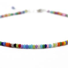 "A tiny rainbow bead anklet. This is such a cute multi color seed bead anklet! The colors include, purple, orange, red, white, green, sky blue, yellow and pink, just to name a few! The beads are made from glass. I hand string these seed beads on beading wire and finish them with a sterling silver lobster clasp and small length of sterling silver chain. This anklet has a 1\" sterling silver chain extension. The length on the listing is the total length measured end to end including the extension. Casual Multicolor Beaded Anklets, Casual Multicolor Round Beads Anklets, Casual Multicolor Tiny Beads Anklets, Casual Multicolor Anklets With Tiny Beads, Multicolor Round Beads Anklets As Gift, Multicolor Round Beads Anklets For Gift, Gift Multicolor Round Bead Anklets, Gift Multicolor Round Beads Anklets, Seed Bead Anklet