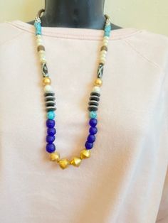 This necklace features Blue recycled african beads, shell beads, jasper beads and agate ornate bead.It is designed to add the extra bohemian vibes to your attire. The length of the necklace is around the 20 inches. This is extremely lightweight necklace.If you have any questions, let me know.Please follow us on Instagram to see more designs:https://www.instagram.com/beadsnshine/Thank you for looking and have a great day ahead. Unique Blue Wooden Beads, Blue Wooden Beads For Festival, Blue Wooden Beads, Blue Wooden Beads Jewelry For Healing, Unique Blue Wooden Beaded Necklaces, Healing Blue Wooden Beads Jewelry, Artisan Blue Wooden Beads, Blue Wooden Beads Jewelry For Festival, Blue Wooden Beads Festival Jewelry