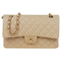 Chanel Beige Lambskin Leather 10" Medium Double Flap Classic Bag with Goldtone Hardware Made In: France Color: Light beige, gold Hardware: Goldtone Materials: Lambskin leather, metal Lining: Beige leather Closure/Opening: Flap top with CC twistlock and snap flap under Exterior Pockets: Half moon patch pocket Interior Pockets: Zipper pocket on top flap, back section under top flap, two wall pockets in middle section, front section Exterior Condition: Excellent Interior Condition: Excellent Includ Beige Chanel Classic Flap Outfit, Chanel Brown Bag, Chanel Bag Classic Flap, Beige Chanel Bag, Chanel Double Flap Bag, Chanel Bag Classic, Chanel Double Flap, Chanel Classic Flap Bag, Chanel Beige