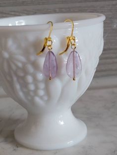 Amethyst earrings,dainty and fun for work or a night out. Hanging on a gold tone latch ear wire. All earrings are handmade to be as close as possible but every stone is unique and individual. Made to be loved and enjoyed. Purple Dainty Earrings With Ear Wire, Dainty Purple Earrings With Ear Wire, Elegant Lavender Earrings With Ear Wire, Everyday Dangle Crystal Earrings With Ear Wire, Dainty Nickel-free Purple Earrings, Everyday Crystal Dangle Earrings With Ear Wire, Dainty Purple Nickel-free Earrings, Handmade Amethyst Drop Earrings, Amethyst Earrings For Gift