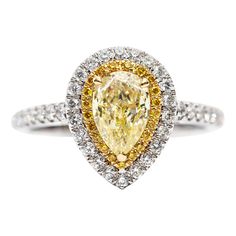 An extremely impressive and bespoke GIA Certified 0.70 - 0.85 ( 7x5 mm) Carat Natural Fancy Yellow Pear Shaped Diamond which is set in the centre of the Ring with Double Halo, the inner halo features 0.08 Carat Round Fancy Yellow Diamonds with 0.38 Carat Color G/H White Round Brilliant Diamonds on the outer halo and around the sides giving this beautiful Double Halo Diamond Engagement Ring an exclusive look and adds timeless glamour in its 18 Karat White Gold setting, please note, when remaking your unique creation, Hasbani Diamonds will hand pick the centre pear shape yellow diamond with an approximate measurement of 7mm x 5mm and no less than 0.70 Carat in weight. This striking piece has a British Hallmarked. Luxury Vvs Clarity Yellow Gold Halo Ring, Yellow Pear Diamond Ring, Luxury Gia Certified Pear-shaped Wedding Ring, Luxury Yellow Pear-shaped Ring, Elegant Yellow Pear-shaped Diamond Ring, Luxury Pear-shaped Diamond Ring With Halo Setting, Gia Certified Luxury Pear-shaped Jewelry, Luxury Gia Certified Pear-shaped Rings, Luxury Platinum Pear-shaped Rings