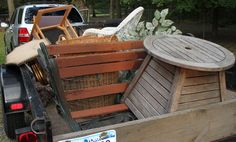 the back end of a pick up truck filled with furniture