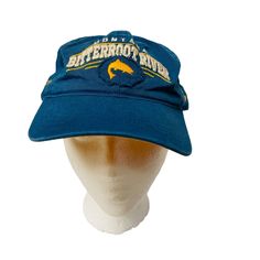 This Vintage Hat from Bitterroot River Montana Freestone Fly Shop is a stylish blue baseball cap. It's unisex and has an adjustable size for a perfect fit.  * Blue, vintage-style baseball cap * From Bitterroot River Montana Freestone Fly Shop * Unisex design * Adjustable size for a perfect fit * Buckle closure * Embroidered Features: * Base Bal Hat Size: Adjustable Condition: Pre-Owned Good Blue Baseball Cap With Visor For Outdoor Activities, Blue Sports Bucket Hat, Blue Fitted Baseball Cap For Outdoor, Blue Adjustable Baseball Cap For Outdoor, Blue Bucket Hat For Sports, Blue Cap For Outdoor Activities, Blue Dad Hat For Outdoor, Blue Fitted Hat For Outdoor, One Size, Blue Dad Hat For Outdoor, One Size