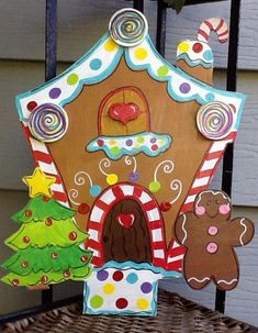 a gingerbread house is decorated with christmas decorations