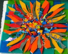 a multicolored piece of art made out of scissors