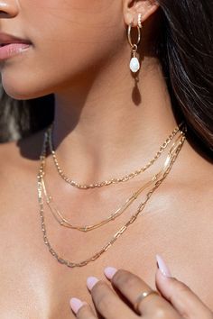 A classic shimmery gold box chain dotted with luminous spheres. This elegant gold chain is a stunning addition to your collection. A striking delicate statement worn alone or with a bevy of other beauties. ✦ DETAILS ✦ ✧ Name: Kahiwa - (kah EE vah) - my favorite. ✧ 1mm chain with 2mm spheres. ✧ 18kt gold filled chain and spring clasp. ✧ You will receive 1 necklace. Other necklaces sold separately. ✧ All Ke Aloha Jewelry pieces come packaged thoughtfully, beautifully, and ready for gift giving. ✧ Gold Link Chain Necklace With Pearls, Gold Pearl Chain Link Necklace, Elegant Layered Necklace With Round Beads, Gold Snake Chain Jewelry With Pearl Detail, Gold Snake Chain Jewelry With Pearl Chain, Gold Jewelry With Pearl Snake Chain, Gold-tone Gold-plated Satellite Chain Necklace, Gold-tone Satellite Chain Necklace, Double Strand Box Chain Necklace For Gift