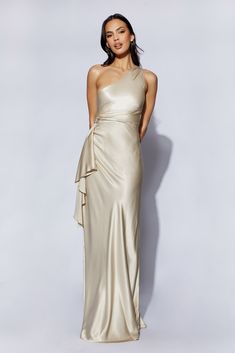 We recommend sizing down in this style. Look as otherworldly and as inspiring as the muses themselves; CALLIOPE is raw, unfiltered grace and beauty. The soft folds and bunches of fabric only serve to enhance how stunning she is in her simplicity. The slanted, single-shoulder neckline, the side-waist waterfall panel, and the draped hem all flatter Calliope’s simple maxi cut. The artistry in the little details is a visual treat. Fluid and poetic, like the muse after whom she’s named, Calliope is s Simple Maxi, One Shoulder Maxi Dress, Satin Maxi, Large Dress, Trending Styles, Satin Maxi Dress, Black Maxi Dress, Guest Dresses, Satin Dresses