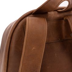 A professional upgrade to the familiar workhorse. The expected features—plenty of interior storage, a handy exterior pocket, comfortably shoulder straps, and an iconic top loop handle—ensure the utility of the bag while the subtle upgrades—an angled zipper into the main compartment for easier access, clever pleats giving the exterior pocket its depth, and, of course, the unique grain and details of the reclaimed leather—will distinguish you from the pack. Rugged Standard Backpack With Adjustable Strap, Classic Waxed Satchel Backpack, Classic Laptop Bag Backpack For Everyday Use, Rugged Bag With Adjustable Strap For Everyday Use, Classic Waxed Finish Backpack, Classic Waxed Finish Standard Backpack, Classic Waxed Finish Backpack For Edc, Classic Backpack With Waxed Finish For Everyday Use, Classic Waxed Finish Backpack For Everyday