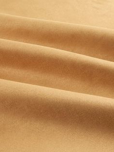 a close up view of a tan colored fabric with very thin lines on the surface