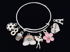 Use this link if you would like to add Birthstones to this bracelet ~ https://www.etsy.com/listing/774404837Little Girl Size adjustable bracelet normally fits children 8 -13 years old (estimation). (This is the Medium Size)Expandable and Completely Adjustable. Medium Size pictured is 4 1/2 inches.  Can be adjusted as small as needed by Gently squeezing the bracelet smaller.  This Medium sized Child bracelet will expand to fit up to a 6 inch wrist.  Stainless Steel Split rings attach charms to ba Themed Pink Bracelets For Birthday, Pink Themed Birthday Bracelets, Fun Charm Bracelets For Birthday, Fun Birthday Charms Bracelets, Fun Charms Bracelets For Birthday, Adjustable Charm Bracelets For Birthday, Customizable Pink Charm Bracelet For Birthday, Cute Silver Charm Bracelet For Birthday, Fun Silver Jewelry For Birthday