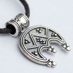 "Slavic Moon symbol/ Pagan Wiccan necklace/ Norse Viking jewelry with meaning Lunula pendant. Celtic women's amulet. Stamped 925 Sterling Silver Lunula (or Lunitsa) is a powerful female charm. Lunula (or Lunitsa) is an ancient Slavic and Viking female amulet. It symbolizes fertility, happy life and good luck. As the Moon has been always associated with female nature, the Lunula pendant is able to connect your female energy with lunar cycle. Lunula mascot is a powerful talisman against evil spiri Adjustable Silver Medallion Jewelry, Spiritual Silver Crescent Necklace, Spiritual Crescent Engraved Jewelry, Silver Medallion Necklace In Symbolic Style, Silver Moon Charm Pendant Jewelry, Good Luck Amulet Jewelry With Round Pendant, Adjustable Engraved Moon-shaped Jewelry, Adjustable Engraved Moon Jewelry, Silver Pendant Jewelry With Moon Charm