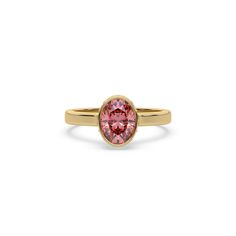 Fancy Pink Oval Diamond Hidden Halo Engagement Ring is made with an fancy Pink oval diamond, set in a bezel setting with a hidden-halo of round diamonds all set in a pave setting on a solid gold band. Details: - Made to Order- Focal Diamond Weight: 1.00 CT, 1.50 CT, 2.00 CT, 2.50 CT, 3.00 CT- Accent Diamond Weight: 0.26 CT - 0.45 CT (Carat weight varies based on chosen Focal Diamond) - Focal Diamond Cut: Oval- Accent Diamond Cut: Round- Diamond Type: Lab Grown Diamond (CVD, HPHT)- Diamond Clarit Oval Hidden Halo Engagement Ring, Fancy Color Diamond Ring, Pink Diamond Engagement Ring, Hidden Halo Engagement Ring, Colored Diamond Rings, Oval Diamond Ring, Solid Gold Band, Halo Earrings, Halo Earrings Studs