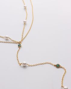 Pearl & Emerald Lariat Necklace Featuring exquisite pearls and vibrant emeralds, this lariat necklace will add elegance and sophistication to any outfit. DETAILS: 14k Gold Vermeil Synthetic pearl and emerald stones Double layered 15" with a 2" extender Lobster clasp Resort Jewelry, Backpack Gift, Beauty Clothes, Emerald Stone, Lariat Necklace, Fine Jewellery Earrings, Outfit Details, Ring Bracelet, Earring Necklace