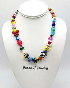 Product Details: "RAINBOW COLLECTION" ...Bohemian style...Hippie style...Fancy & Fun!! * Necklace is a ONE OF A KIND! Very Bright & Colorful!!  All of my Rainbow Necklaces will now include a FEW GLASS LAMPWORK BEADS that I have personally created, from a glass rod to flame, then properly annealed in my kiln and cleaned. Those beads are original artwork and one of a kind. (as seen in last photo). * Necklace Length: 18" inches * Clasp: Stainless-steel Lobster Clasp & Parts * This RAINBOW Necklace is made with a collection of Fun Style Smaller Size Beads, Glass Beads, Clay Beads, Gemstone Beads, Murino Glass Beads, Crystal Beads, Wooden Beads, Ceramic Beads & More!! * This Beaded Rainbow Necklace has a Panda Bead, Brown Owl Bird, Hot Pink Turtle, Heart Bead, Yellow Emoji Bead, Dice Bead, Red Handmade Colorful Adjustable Beaded Necklaces, Adjustable Beaded Fun Jewelry, Hippie Style Colorful Round Bead Jewelry, Handmade Multicolor Jewelry For Beach, Adjustable Spiritual Beaded Necklace With Heart Beads, Colorful Bohemian Beaded Necklaces With Heart Beads, Bohemian Heart Beads Jewelry For Festivals, Fun Multicolor Beaded Necklace With Large Beads, Bohemian Adjustable Beaded Necklaces With Heart Beads