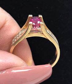 GORGEOUS RUBY AND DIAMOND BAND RING This gorgeous 14k gold ruby and diamond ring will make a perfect addition to any jewelry collection! In excellent condition Oval cut center ruby measures approximately 4mm x 6mm. Gorgeous bright round genuine diamonds set in a double row behind.   Weighs 3.4 grams  Shipped insured/delivery confirmation I guarantee item to be exactly as described and pictured. Black Opal Pendant, Ruby And Diamond Ring, Diamond Band Ring, Princess Ring, Cabochon Ring, Red Band, Black Gift Boxes, Diamond Rings Bands, Multi Stone Ring