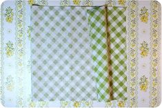 the fabric is green and white checkered with yellow flowers on it's border