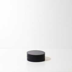 a black object sitting on top of a white table