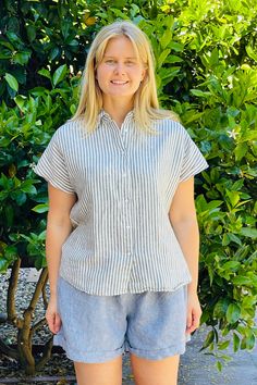 Material: 100% Linen. Description: Relaxed striped Linda linen shirt is easy going with shorts, skirt or jeans. Button down, cap sleeves and straight cut. ONE SIZE Color: Blue/White. Measurements: Bust: 45" Length: 24". Fits US size 6-12. Model is 5'8". Piironki Helsinki is Finnish lifestyle company established 1978. Their focus is relaxed, beautiful and cozy living. Finnish Lifestyle, Marimekko Fabric, Shorts Skirt, Denim Color, Jeans Button, Linen Shop, Dress Gift, Easy Going, Wide Legs